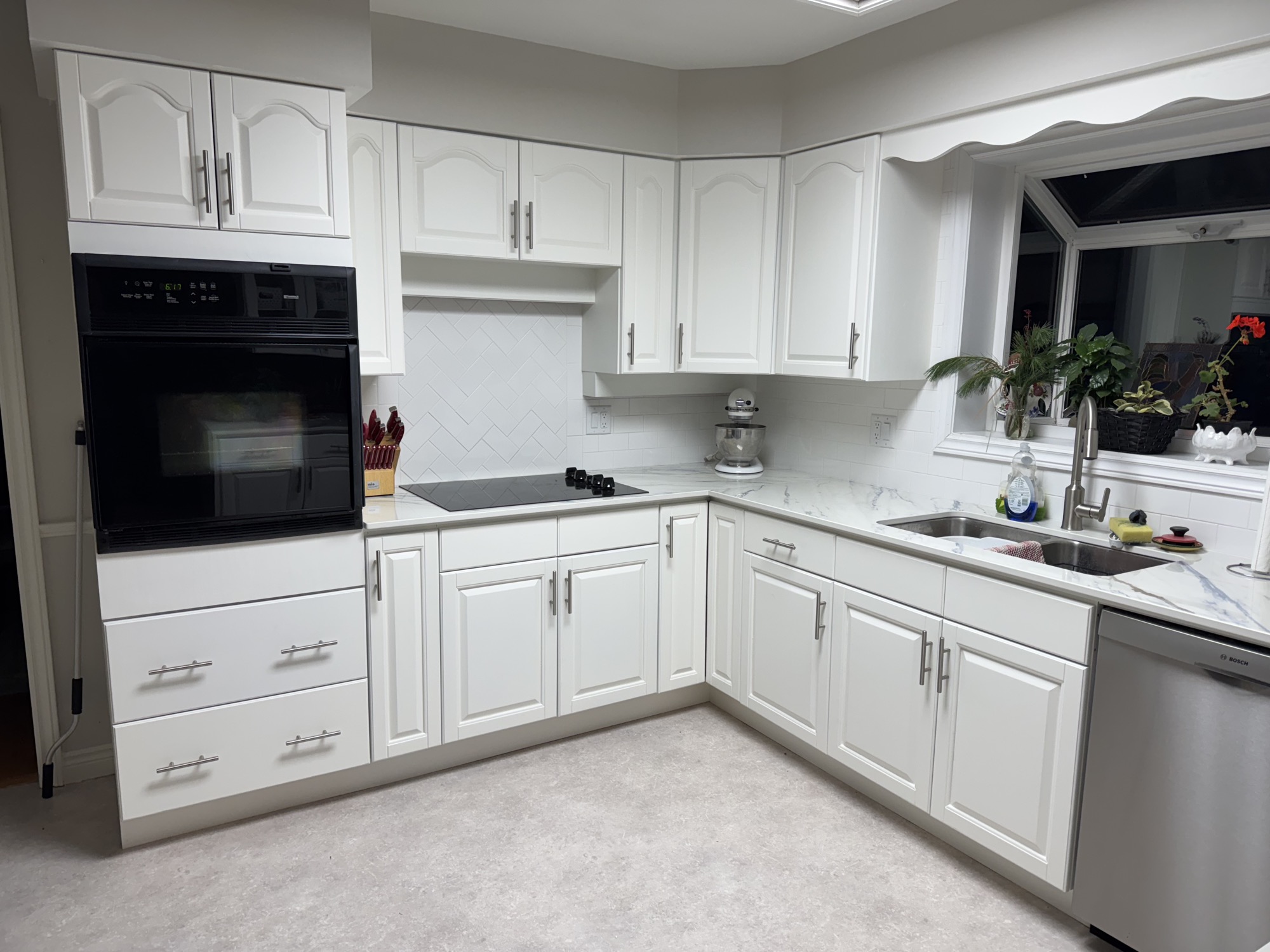 Kitchen makeover with sleek countertops. - After