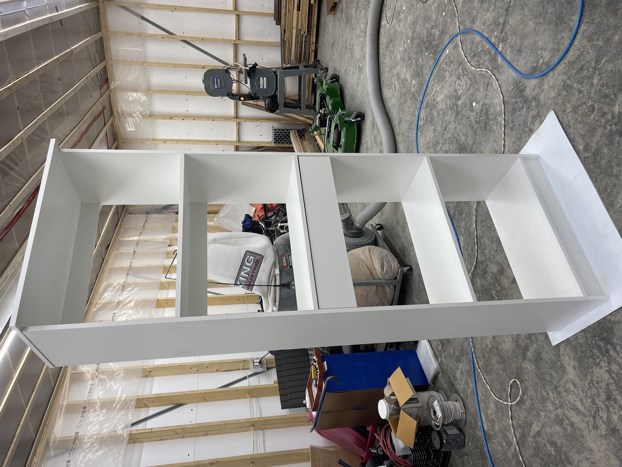 Walk-in closet with custom shelving.