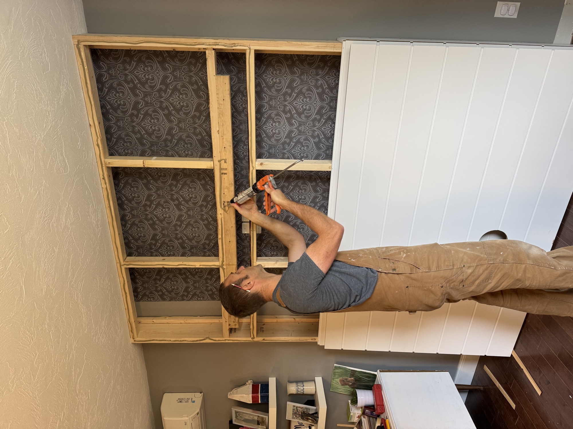 Electric fireplace mantel with TV.